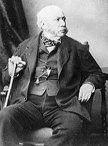 Charles Yorke, 4th Earl Hardwicke as an elderly man, seated with his right hand resting on a walking stick, looking away to his left. A portly gentleman with very Victorian mutton chop whiskers and irascible expression.