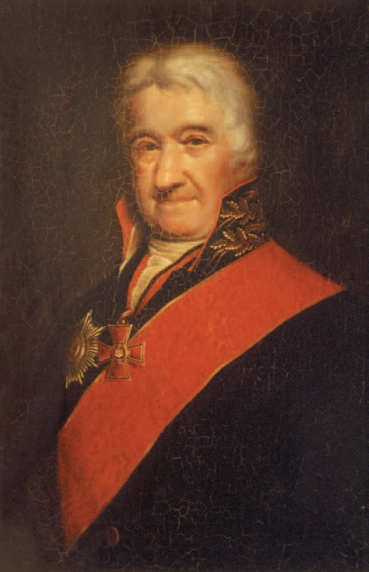 Charles Gascoigne looking extremely proud of himself. He wears a splendid red sash across his black coat, the high coat collar embroidered in gold. The cross of St Vladimir hangs round his neck on a black and red ribbon, the star of St Anne is pinned to his right breast