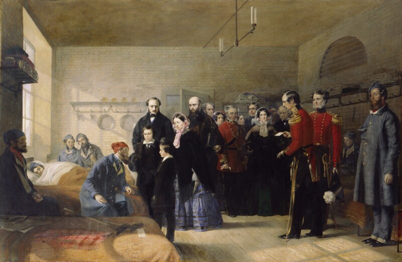 Oil painting depicts Queen Victoria with two young princes and escorted by officers in red coats visiting wounded soldiers in a hospital ward