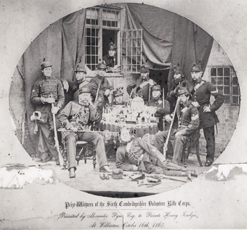 Ely Rifle Volunteers pictured with prizes after a shooting competition, 1863